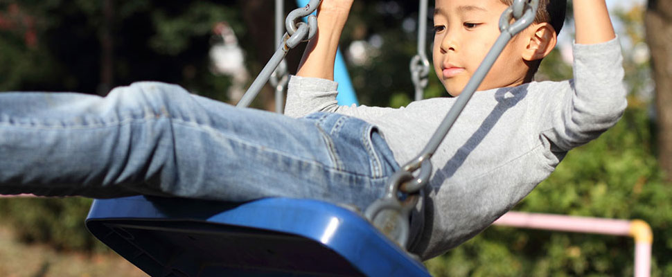 a little boy on a swing